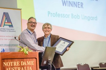 AARE President Martin Mills presenting an Honorary Life Membership to Professor Bob Lingard